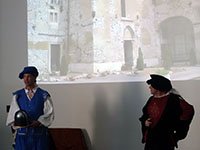 The Knight is greeted at a castle